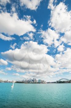 Clouds over skyline of Sydney with city central business district and Sydney Harbour Bridge.
Very wide angle shooting