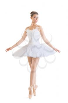 beautiful ballerina in classical tutu on a white background
