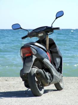 Royalty Free Photo of a Motorbike on a Beach