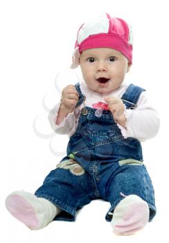 Royalty Free Photo of a Baby in Denim Holding a Pacifier