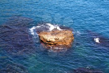 Royalty Free Photo of a Rock in the Sea