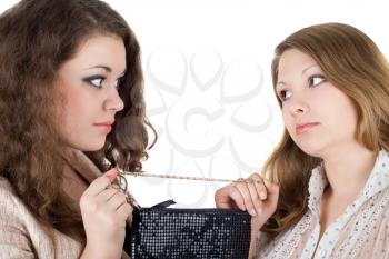 Royalty Free Photo of Two Women Tugging on a Handbag Strap