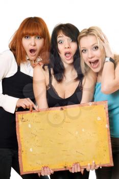 Royalty Free Photo of Three Young Women Holding a Board