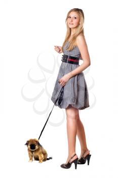 Royalty Free Photo of a Young Girl Walking a Dog