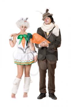 Royalty Free Photo of a Man and Woman in Bunny Costumes With a Big Carrot
