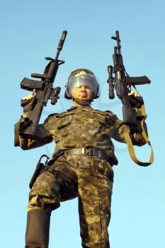 Royalty Free Photo of a Soldier With Guns