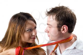Royalty Free Photo of a Woman Wrapping a Scarf Around a Man's Neck