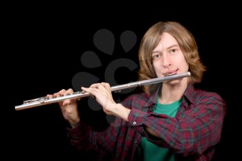 Royalty Free Photo of a Man Playing the Flute