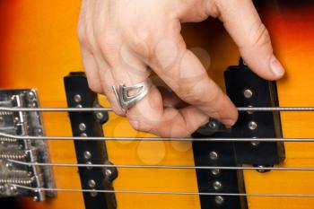 Royalty Free Photo of Hands on a Guitar String