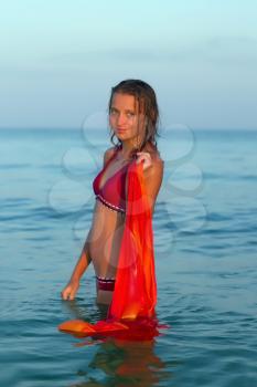 Portrait of a beautiful teen girl in the sea