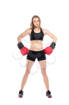 Young sporty woman posing with boxing gloves. Isolated on white