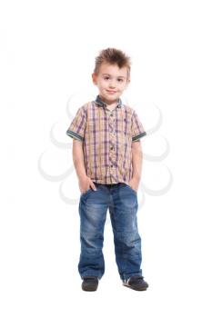 Handsome little boy posing in casual clothes. Isolated on white