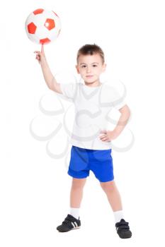 Playful little boy holding the ball on his finger. Isolated