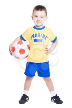 Nice little Ukrainian football player posing with a ball. Isolated on white
