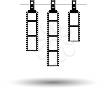 Icon of photo film drying on rope with clothespin. White background with shadow design. Vector illustration.
