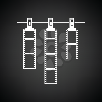 Icon of photo film drying on rope with clothespin. Black background with white. Vector illustration.