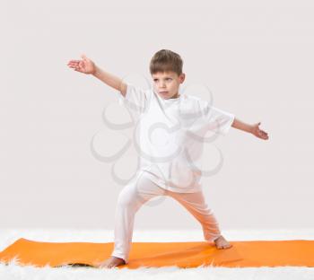 Royalty Free Photo of a Boy Doing Yoga