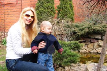 Royalty Free Photo of a Mother and Son in a Garden