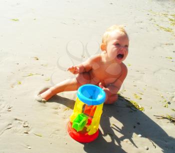Royalty Free Photo of a Boy Playing on the Beach