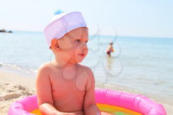Royalty Free Photo of a Little Boy Playing at the Beach