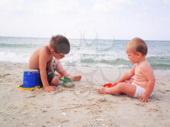 Royalty Free Photo of Two Little Boys Playing at the Beach