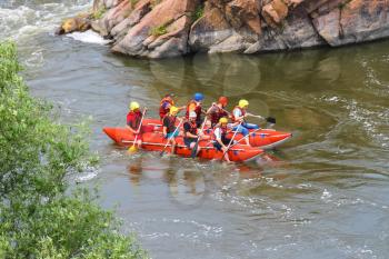 NIKOLAEV, VILLAGE GRUSHEVKA, UKRAINE - MAY 23, 2014: Rafting tourists with an experienced instructor on the river Southern Bug