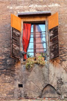 Window with shutters in old Italian house
