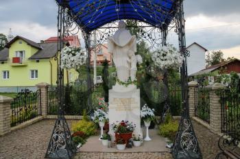 Schodnica, Ukraine - June 30, 2014: Statue of Virgin Mary, Mother of God in Carpathians