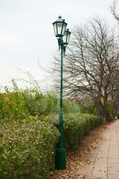 Royalty Free Photo of an Avenue Lantern on Autumn and Cloudy View Alley 