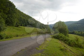 Royalty Free Photo of a Mountain Rural Road With Trees