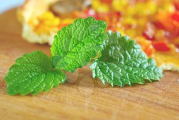 Mint green leaves with food background. Green natural peppermint leaf food ingredients. Spice herbal eating.