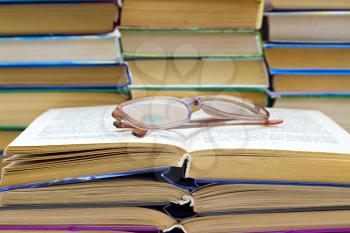 Royalty Free Photo of Reading Glasses on a Stack of Books