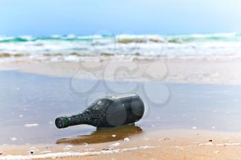 Royalty Free Photo of a Bottle on the Beach