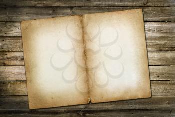 Old vintage paper on wooden grungy background