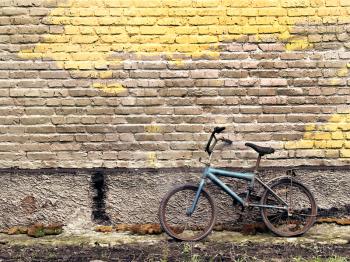 Royalty Free Photo of a Bike Against a Wall