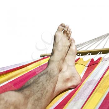 feet in the hammock isolated on  white background