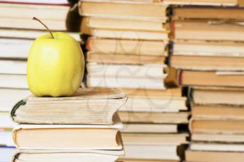 Royalty Free Photo of an Apple on a Stack of Books