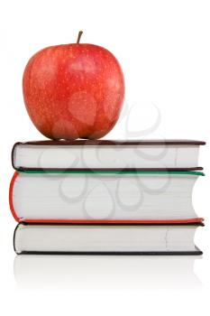 Royalty Free Photo of an Apple on a Stack of Books