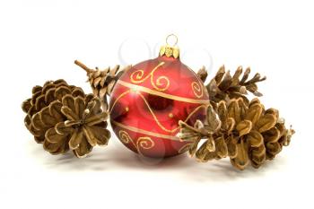 Royalty Free Photo of a Christmas Ornament and Pine Cones