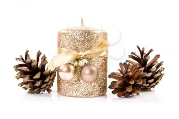 Royalty Free Photo of a Candle and Pine Cones