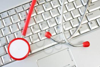Royalty Free Photo of a Stethoscope on a Computer