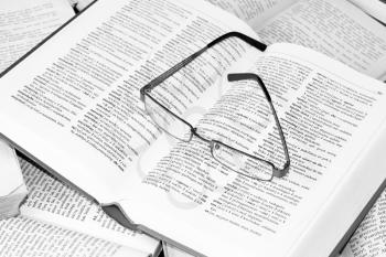 Royalty Free Photo of Glasses on a Dictionary