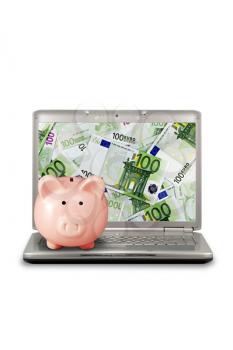 Royalty Free Photo of a Piggy Bank on a Laptop