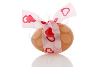 Royalty Free Photo of an Egg With a Ribbon