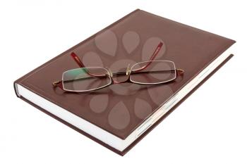 Royalty Free Photo of Glasses on a Notebook