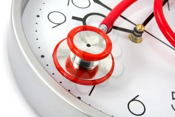 Royalty Free Photo of a Stethoscope on a Clock