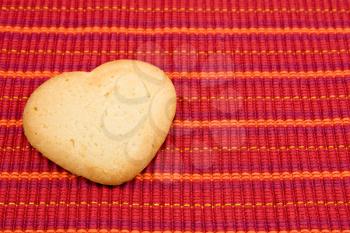 Royalty Free Photo of a Cookie on a Tablecloth