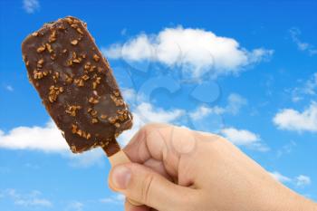 Royalty Free Photo of a Person Holding Ice Cream