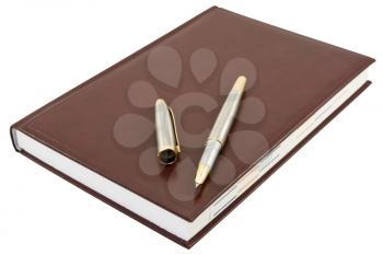 Royalty Free Photo of a Pen on a Notebook