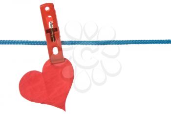 crumpled paper heart hung on clothesline. isolated on white background